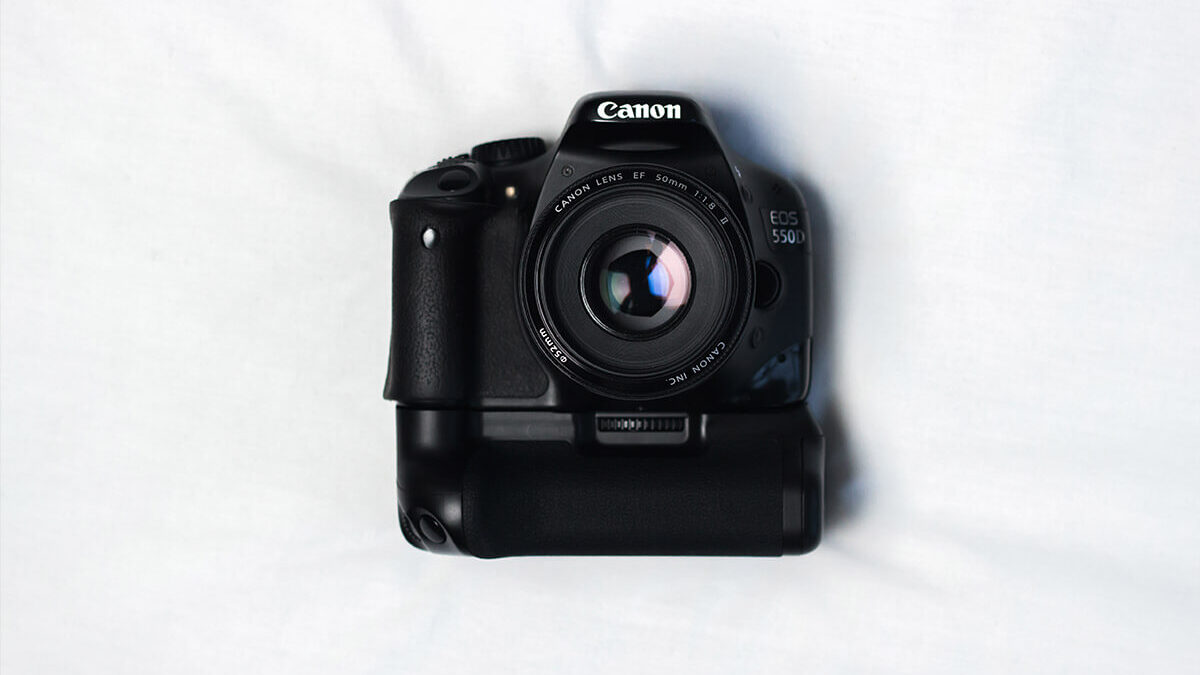 Nothing Can Beat Black Camera On White Silky Cloth